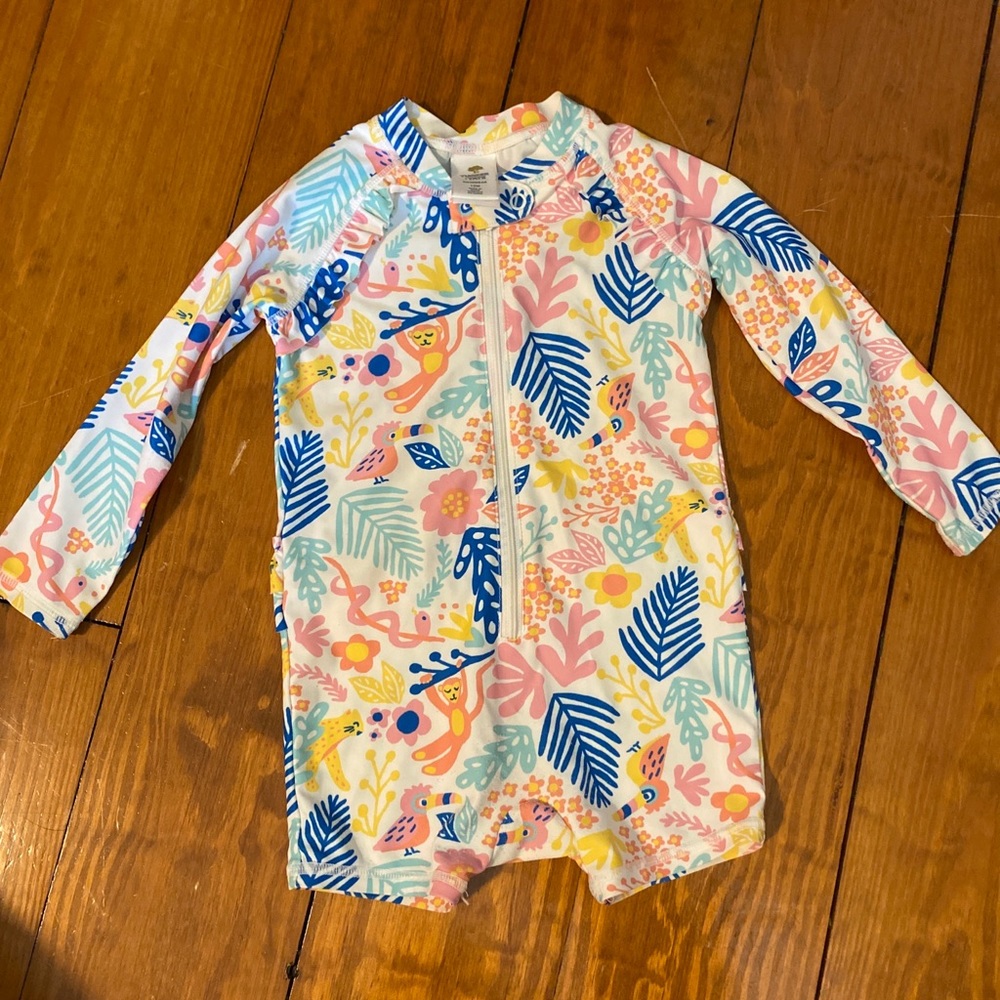Tucker + Tate 12 month swimsuit. With little shorts and a ruffle on the back